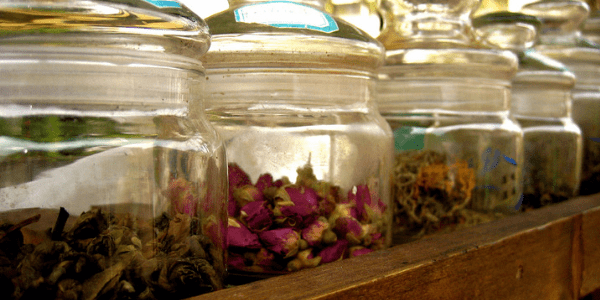 Jars of dried flowers and herbs, photo by Alexandra Moss